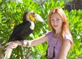 Portrait of woman with bird toucan