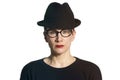 Portrait of woman with black hat and glasses