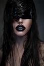 Portrait of woman with black lips