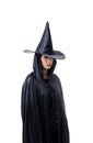 Portrait of woman in black Scary witch halloween costume standing with hat isolated on white background