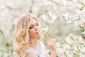 Portrait of a woman in a blooming garden