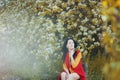 Portrait of a woman in blooming trees. Spring season specific. Dreamy. Blossom. Happy Royalty Free Stock Photo