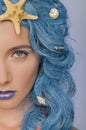 Portrait of woman with blue hair and shells Royalty Free Stock Photo