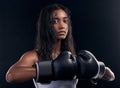 Portrait, woman and boxer with fitness, serious and ready for match, confident and dark studio background. Face, female Royalty Free Stock Photo