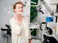 Portrait of woman with braces demonstrating teeth brushing Royalty Free Stock Photo