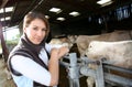 Portrait of woman breeder in barn