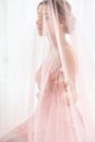 Portrait of a woman. Bride with a pink veil. Royalty Free Stock Photo