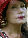 Portrait. Woman in a bright red hat.