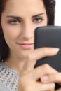 Portrait of a woman browsing her smart phone Royalty Free Stock Photo