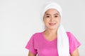 Portrait of a woman cancer patient with clothes covered around head affected from chemotherapy cure process posing with positive Royalty Free Stock Photo