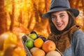 Composite image of portrait of woman carrying fruits and vegetables in basket Royalty Free Stock Photo