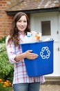 Portrait Of Woman Carrying Recycling Bin Royalty Free Stock Photo