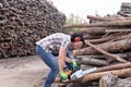 Portrait of a woman with a chainsaw