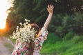 Portrait young beautiful woman with chamomile flowers at sunset. Royalty Free Stock Photo