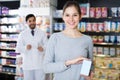 woman is satisfied of purchase in pharmacy