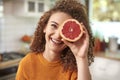 Woman covering her eye with grapefruit Royalty Free Stock Photo