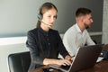 Portrait of woman customer service worker, call center smiling operator with phone on office Royalty Free Stock Photo