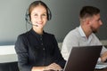 Portrait of woman customer service worker, call center smiling operator with phone on office Royalty Free Stock Photo