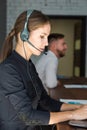 Portrait of woman customer service worker, call center smiling operator with phone on office Royalty Free Stock Photo