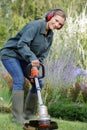 portrait woman cutting grass Royalty Free Stock Photo