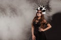 Portrait of Woman at Dia de los Muertos Sugar Skull makeup isolatet background with smoke Royalty Free Stock Photo