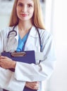 Portrait of woman doctor with folder at hospital corridor Royalty Free Stock Photo