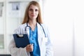 Portrait of woman doctor with folder at hospital Royalty Free Stock Photo