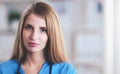 Portrait of woman doctor with stethoscope at hospital corridor Royalty Free Stock Photo