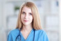 Portrait of woman doctor with stethoscope at hospital corridor Royalty Free Stock Photo