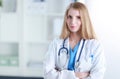 Portrait of woman doctor with stethoscope at hospital corridor Royalty Free Stock Photo