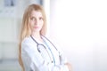 Portrait of woman doctor with stethoscope at hospital corridor Royalty Free Stock Photo
