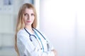 Portrait of woman doctor with stethoscope at hospital corridor Royalty Free Stock Photo