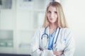 Portrait of woman doctor with stethoscope at hospital corridor Royalty Free Stock Photo