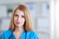 Portrait of woman doctor with stethoscope at hospital corridor Royalty Free Stock Photo