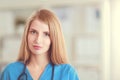 Portrait of woman doctor with stethoscope at hospital corridor Royalty Free Stock Photo