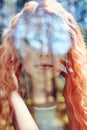 Portrait of a woman with a double exposure, the girl and the blurred nature of the photo is not in focus. The leaves on the woman. Royalty Free Stock Photo