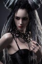 Portrait of woman with dreads and festive black gothic dress Royalty Free Stock Photo