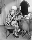 Portrait of woman at dressing table Royalty Free Stock Photo