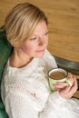 Portrait of a woman drinking coffee