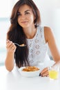 Portrait of woman eating cereals. Healthy eating. Health care.