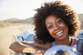 Portrait Of Woman Enjoying Road Trip In Open Top Classic Car Royalty Free Stock Photo