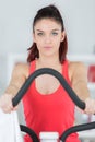 portrait woman exercising on step machine