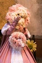 Portrait of woman with fantastic carnival mask send a kiss