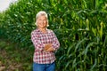 Portrait of a woman farmer in a cornfield.Woman farmer harvesting corn Royalty Free Stock Photo