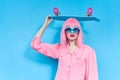 portrait of a woman fashion blue glasses skateboard isolated background Royalty Free Stock Photo