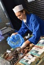 Portrait of woman fishmonger at work Royalty Free Stock Photo