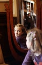 Portrait of a little girl in front of a mirror Royalty Free Stock Photo