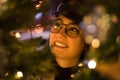 Portrait of a woman gazing at Christmas decoartion outdoors