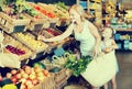 Portrait of woman and girl buying fresh fruits Royalty Free Stock Photo