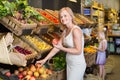 Portrait of woman and girl buying fresh fruits Royalty Free Stock Photo